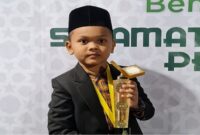 Qori cilik Muhammad Ahsin siswa SD asal Kota Langsa, menjadi pembaca Al-Qur’an pada open ceremony PON XXI Aceh-Sumut di stadion Harapan Bangsa Banda Aceh pada Senin (9/9/24)