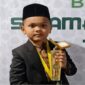 Qori cilik Muhammad Ahsin siswa SD asal Kota Langsa, menjadi pembaca Al-Qur’an pada open ceremony PON XXI Aceh-Sumut di stadion Harapan Bangsa Banda Aceh pada Senin (9/9/24)
