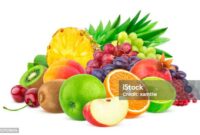 Heap of different fruits and berries isolated on white background with clipping path